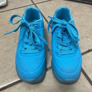 Girl sketchers sneakers.